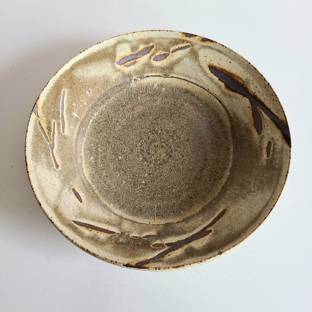 Handmade stoneware ceramic plate/bowl. Signed by artist Kim Bruce.